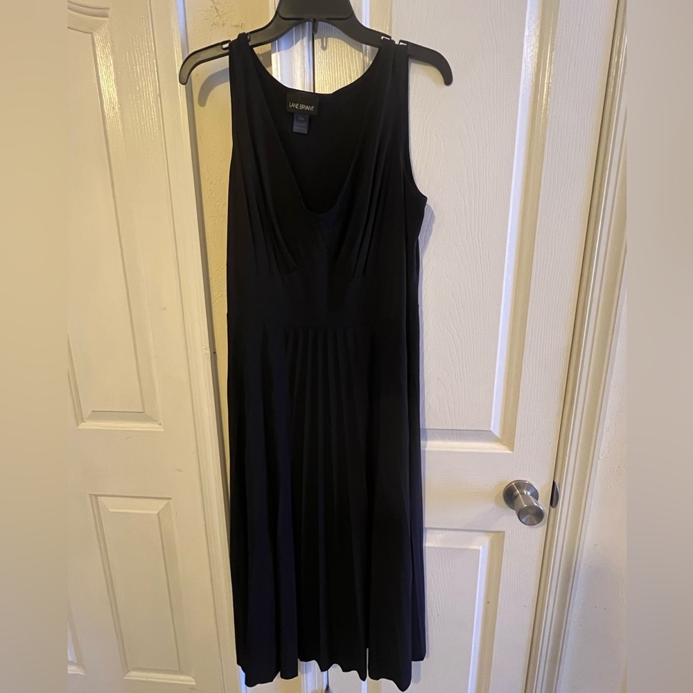 Woman’s black pleated dress